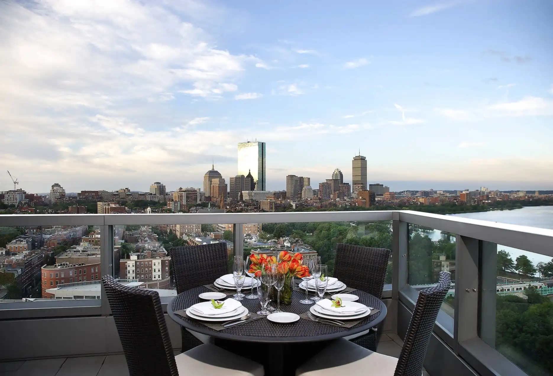 Rooftop terrace with dining table and city view